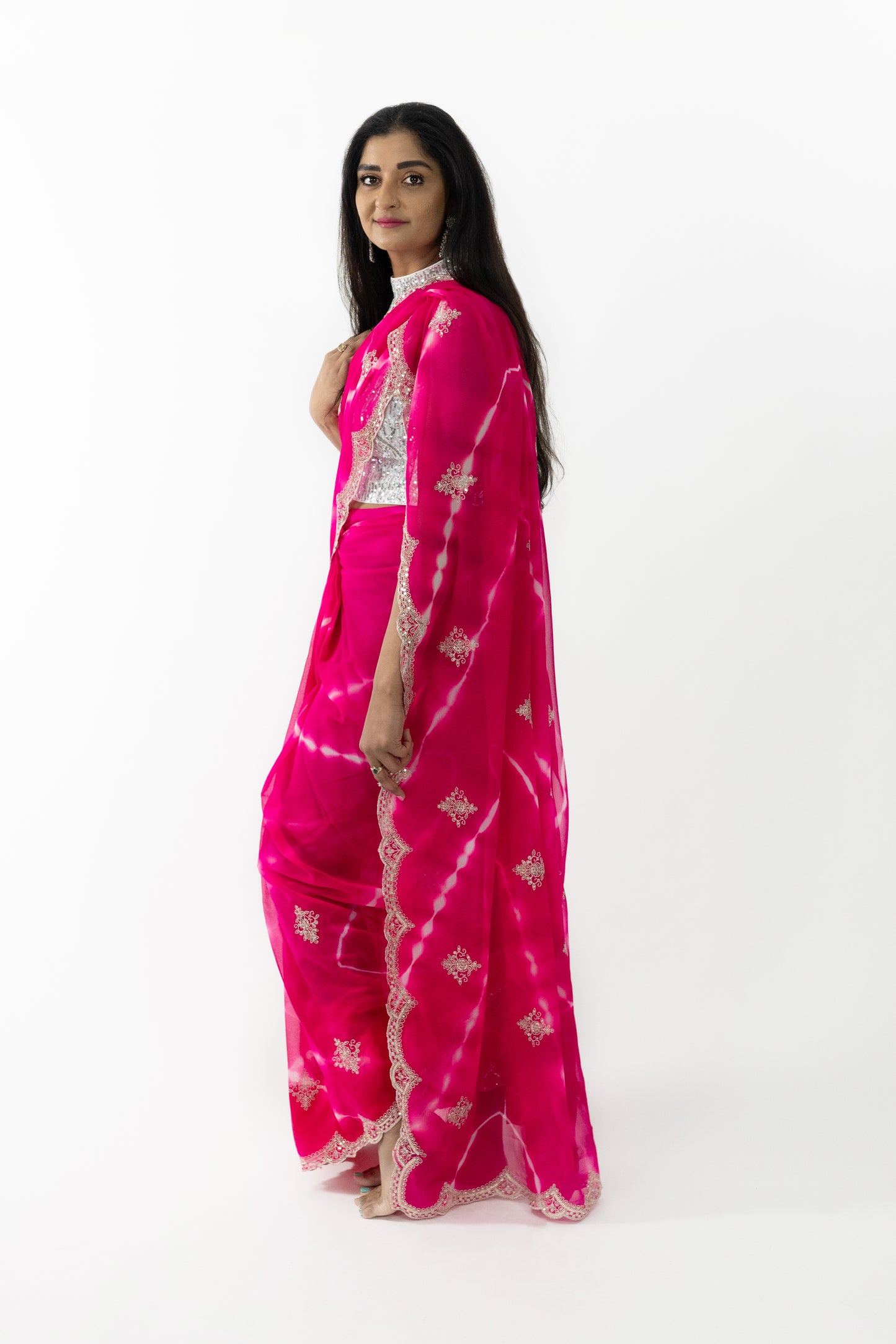 Intricate cherry blossom embroidery on a pink Cherry Blossom Georgette Saree, showcasing meticulous craftsmanship.