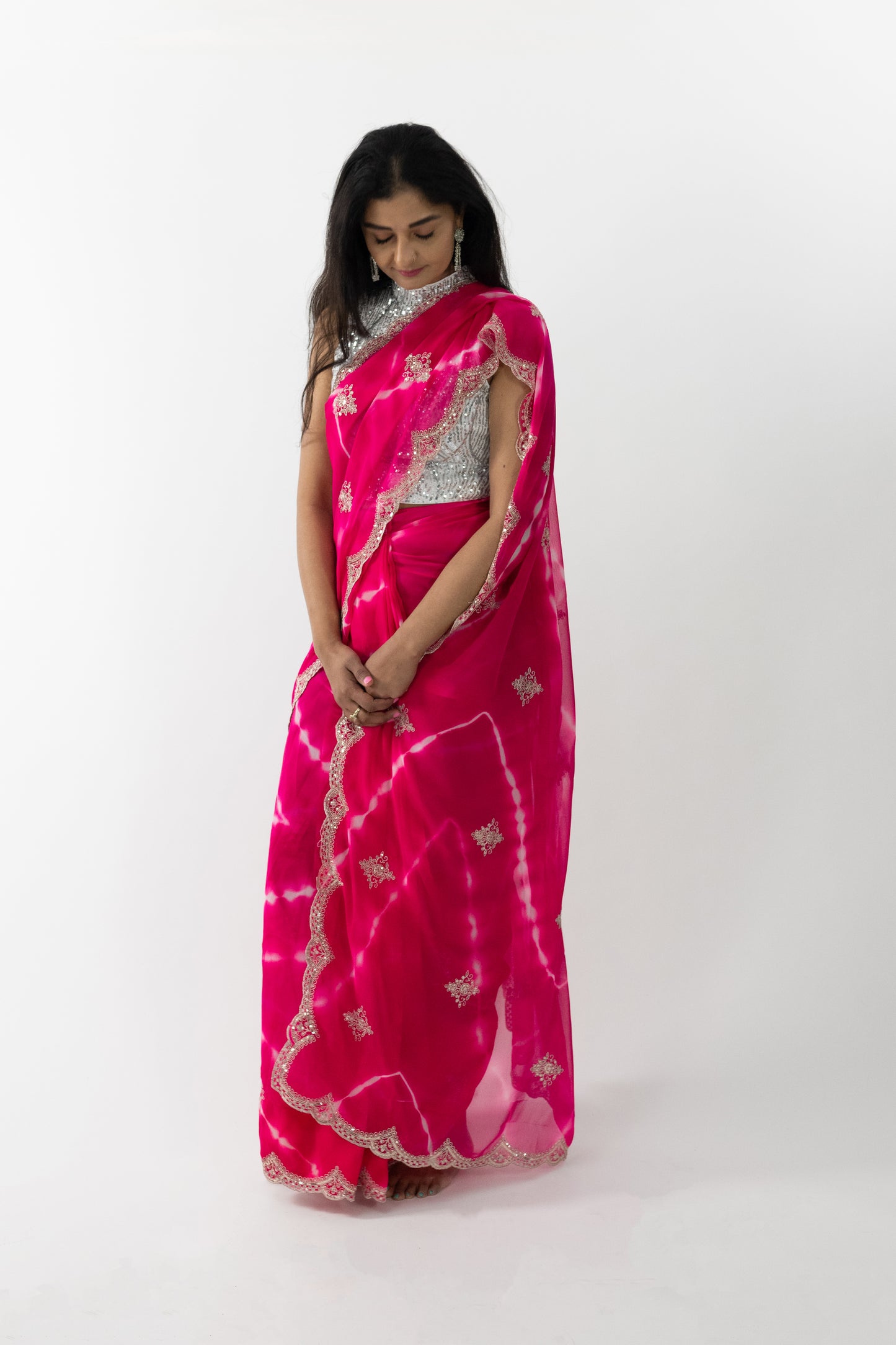 Close-up of the intricate cherry blossom embroidery on a pink Cherry Blossom Georgette Saree, showcasing meticulous craftsmanship