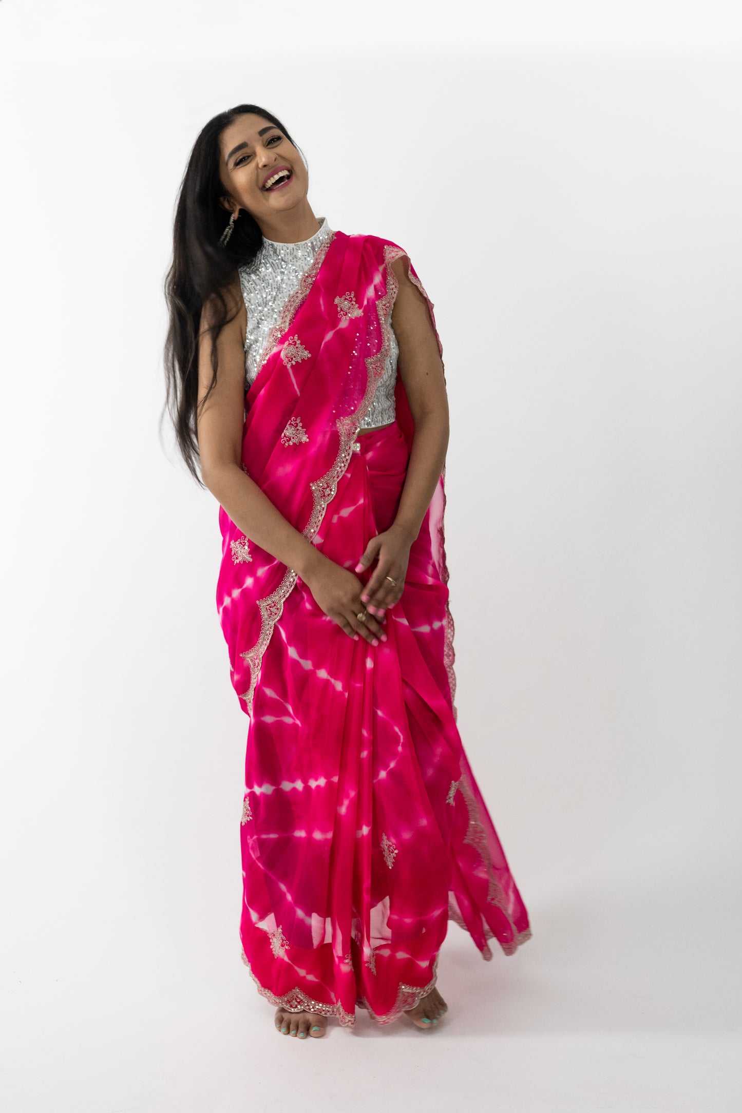 Close-up of the intricate cherry blossom embroidery on a pink Cherry Blossom Georgette Saree, showcasing meticulous craftsmanship