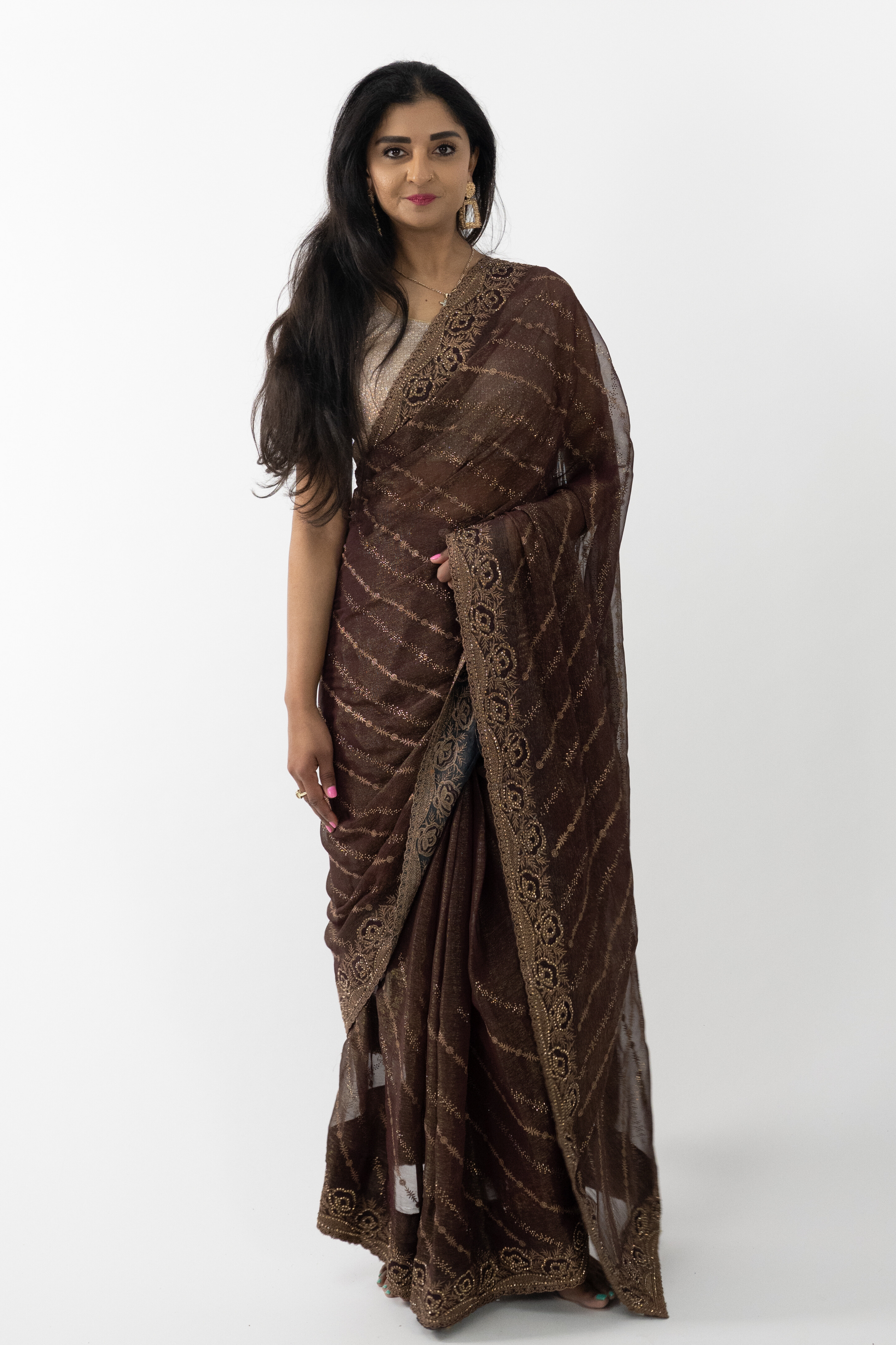  luxurious Bronze Simar Silk Saree with intricate embroidery and a rich bronze hue, perfect for special occasions.