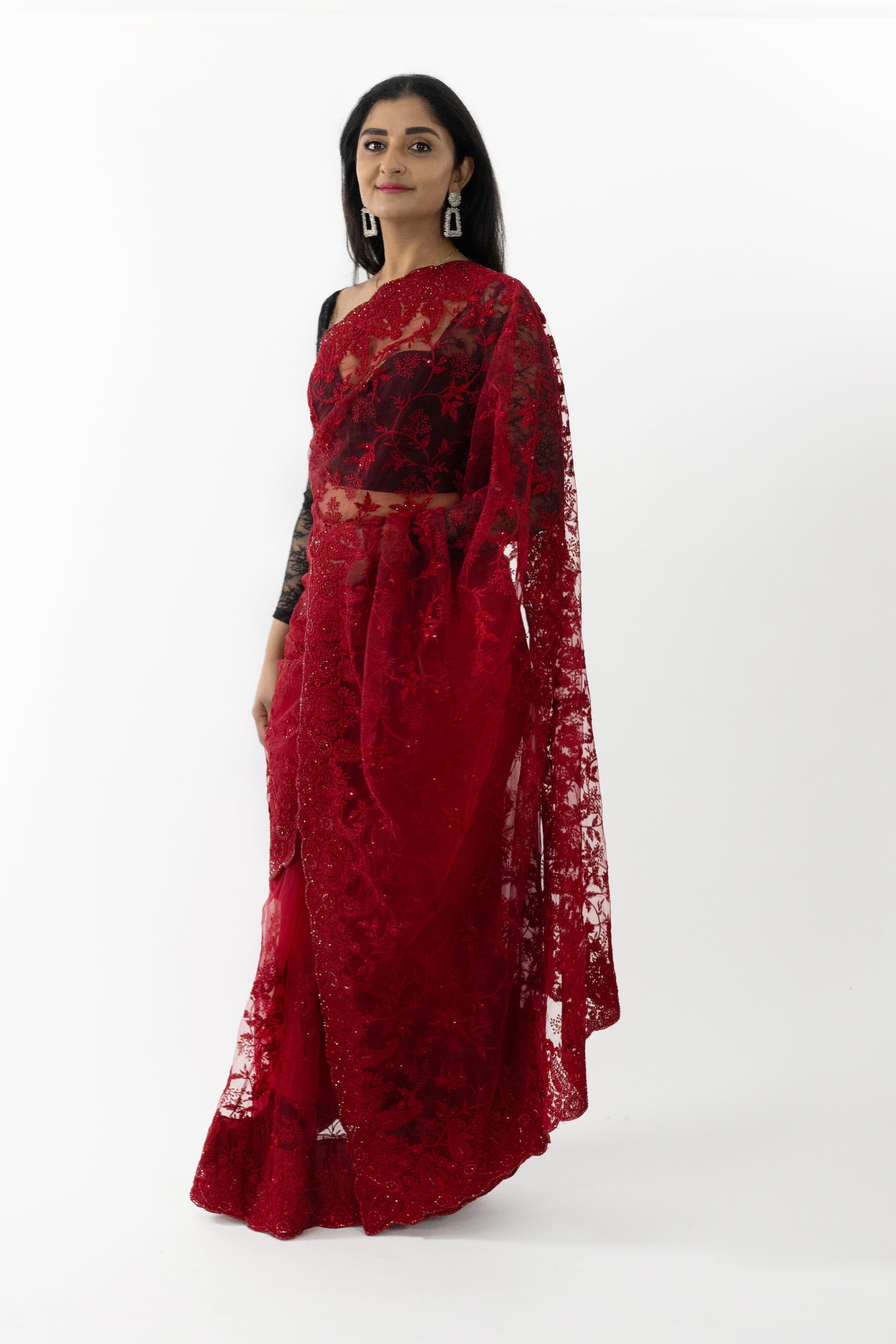 Side Back view of a model wearing a Butterfly Radiance Net Saree, highlighting the delicate net fabric and whimsical butterfly motifs