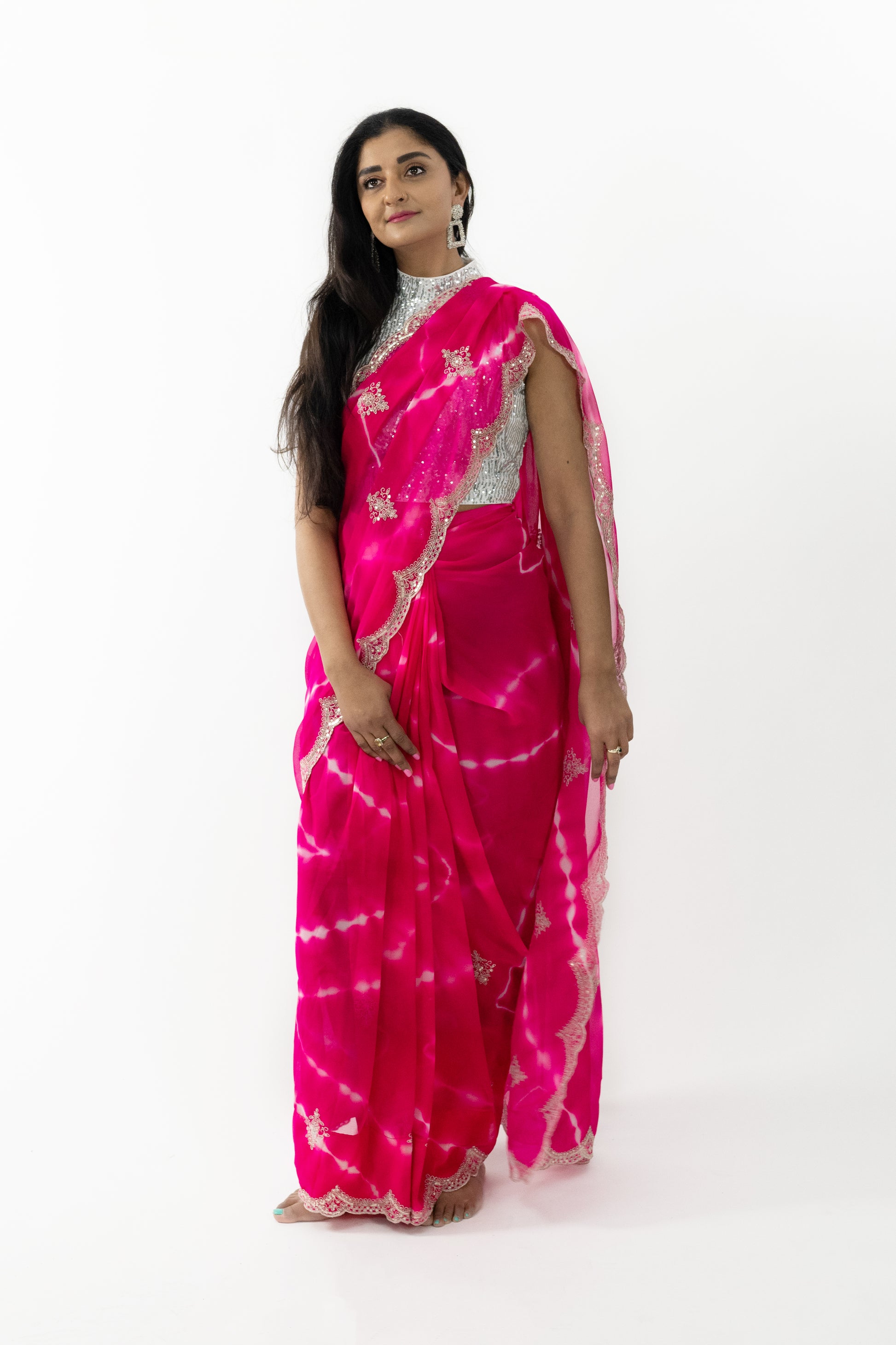  Model wearing a Cherry Blossom Georgette Saree, highlighting the soft, flowing fabric and exquisite cherry blossom motifs.