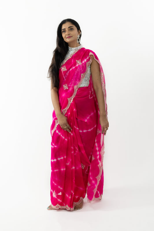  Model wearing a Cherry Blossom Georgette Saree, highlighting the soft, flowing fabric and exquisite cherry blossom motifs.