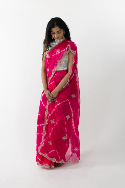 Close-up of the intricate cherry blossom embroidery on a pink Cherry Blossom Georgette Saree, showcasing meticulous craftsmanship