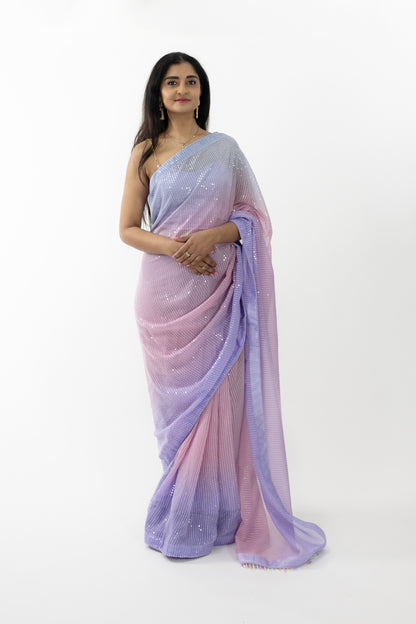  A close-up shot highlighting the sequin details on the ready-to-wear lavender georgette saree in Australia. The intricate patterns showcase meticulous artistry, adding a layer of sophistication. The soft and lightweight fabric drapes beautifully, making it a stunning choice for any elegant event.