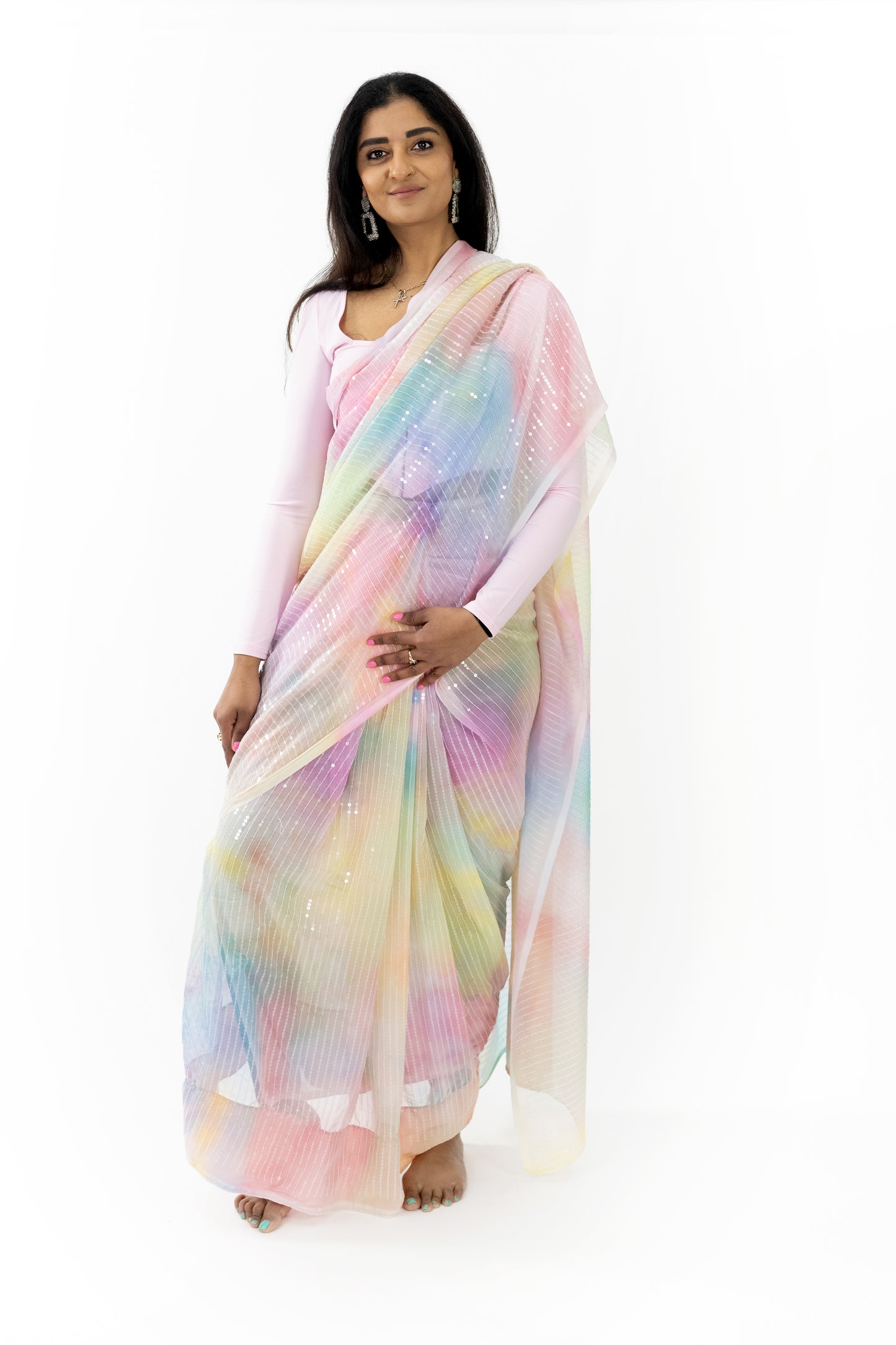 Radiant Blossom Georgette Saree” in a delicate light pink hue, showcasing its radiant, iridescent quality. The saree’s premium georgette fabric is soft, lightweight, and flowing, providing a comfortable and flattering fit. This ready-to-wear saree is ideal for special occasions in Australia.