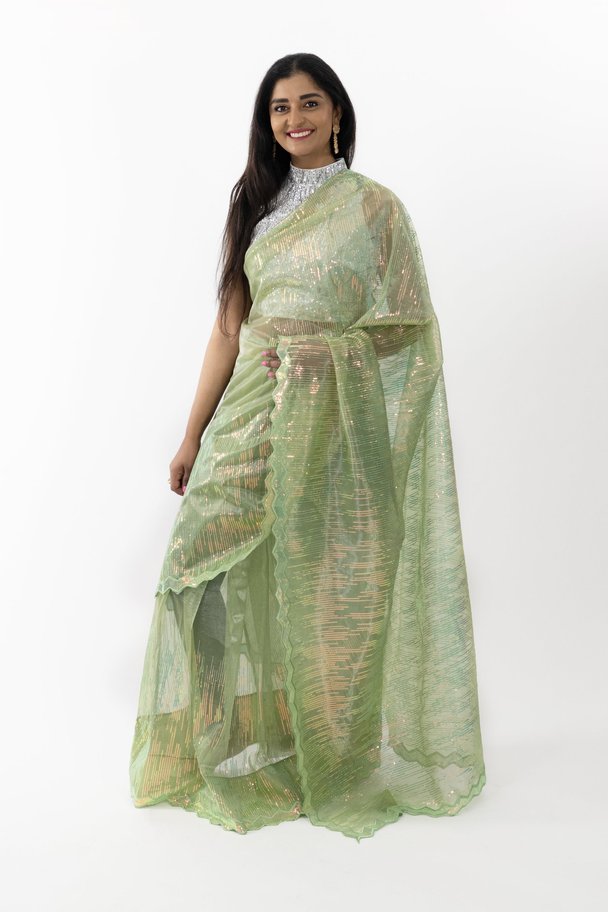 Model showcasing the front view of a Lime Aura Net Saree in a refreshing lime hue with intricate embroidery, perfect for special occasions