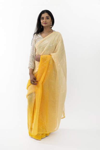 Close-up of the delicate patterns on a Radiant Blossom Georgette Saree, showcasing fine artistry and the vibrant yellow color that adds a touch of sunshine to any event