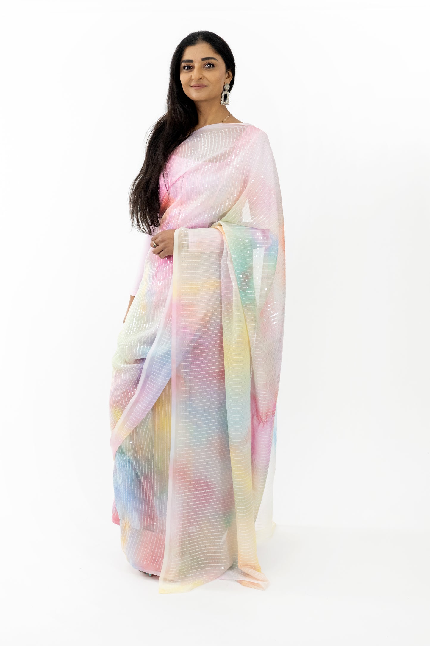 A close-up shot highlighting the radiant, iridescent quality of the ready-to-wear light pink georgette saree in Australia. The soft and lightweight fabric drapes beautifully, making it a stunning choice for any elegant event. The gentle light pink hue exudes femininity and sophistication.